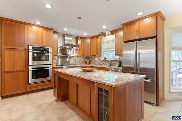 2657 Coralberry Pl, Charlottesville, VA 22911 - kitchen with appliances with stainless steel finishes, wall chimney range hood, wine cooler, a center island, and tasteful backsplash