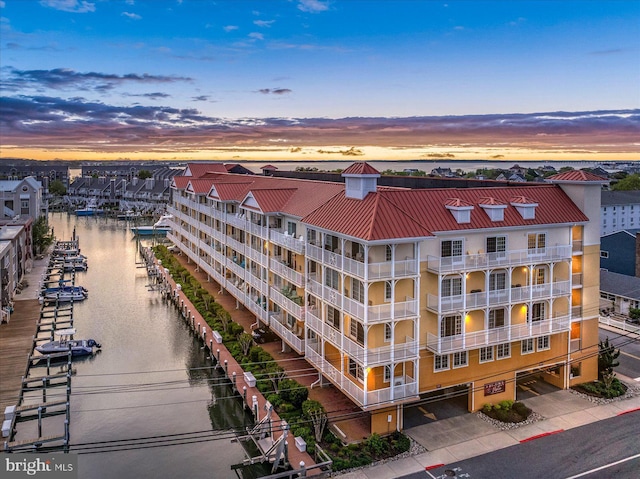 301 14th St Unit 308/309, Ocean City, MD 21842 - property at dusk featuring a water view
