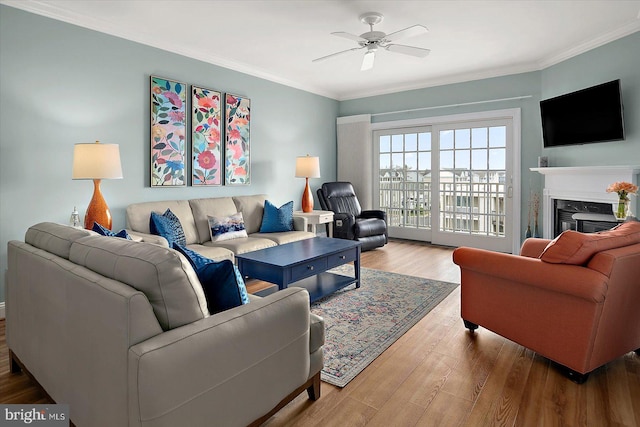 301 14th St Unit 308/309, Ocean City, MD 21842 - living area with a high end fireplace, a ceiling fan, wood finished floors, and crown molding