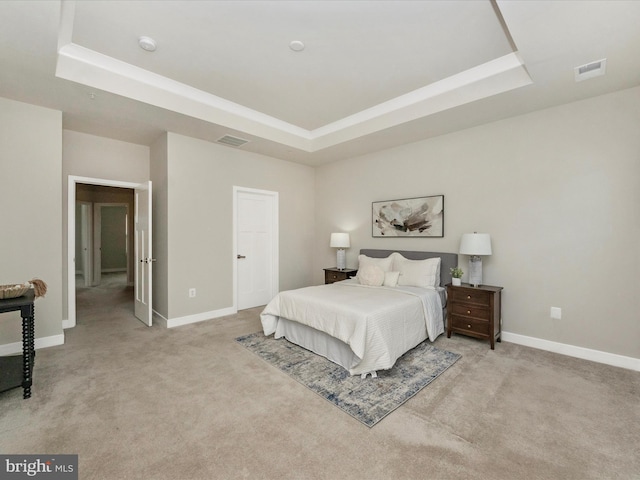 14716 Spring Haven Ln, Laurel, MD 20707 - bedroom with a tray ceiling, light carpet, and baseboards