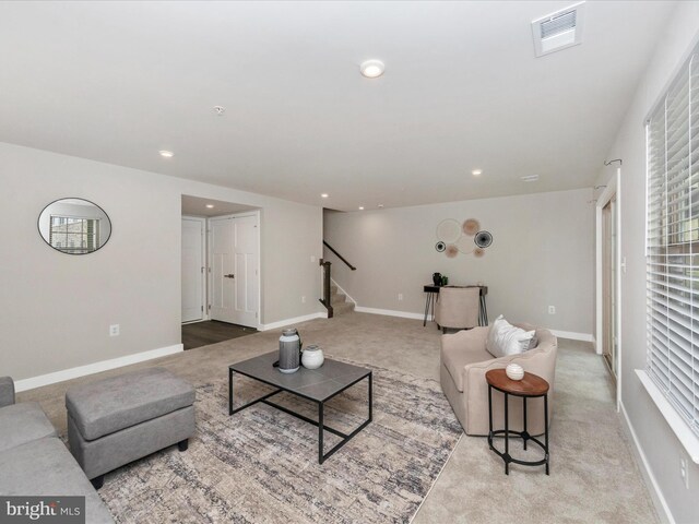 14716 Spring Haven Ln, Laurel, MD 20707 - carpeted living area featuring stairs, recessed lighting, and baseboards