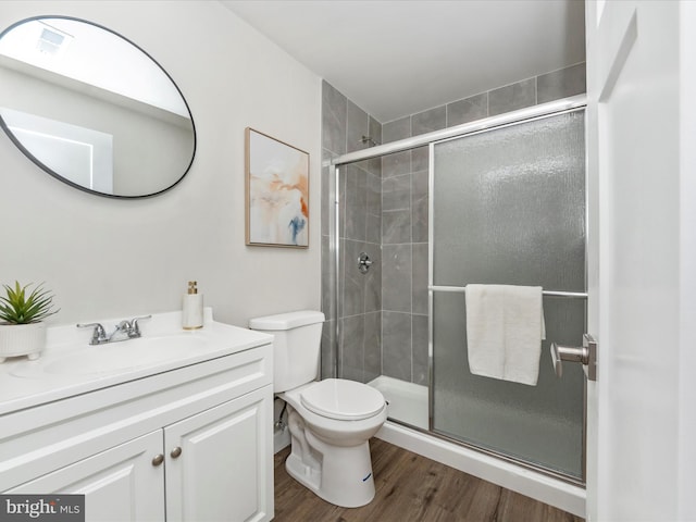 14716 Spring Haven Ln, Laurel, MD 20707 - bathroom featuring wood finished floors, a shower stall, toilet, and vanity