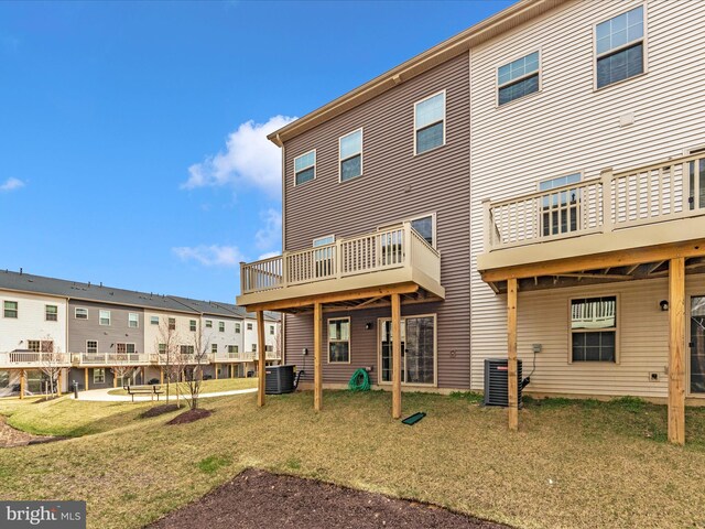 14716 Spring Haven Ln, Laurel, MD 20707 - back of house with central air condition unit, a lawn, and a residential view