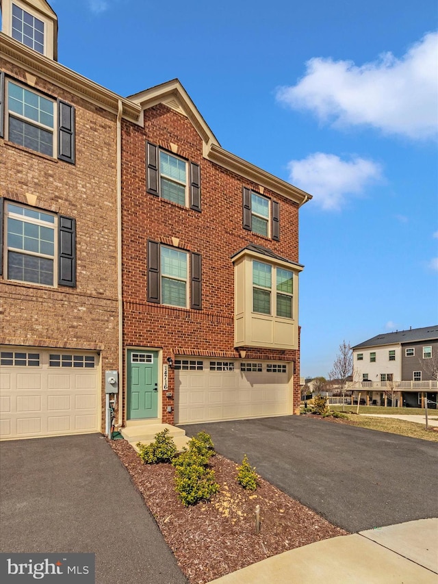 14716 Spring Haven Ln, Laurel, MD 20707 - multi unit property with driveway, a garage, and brick siding
