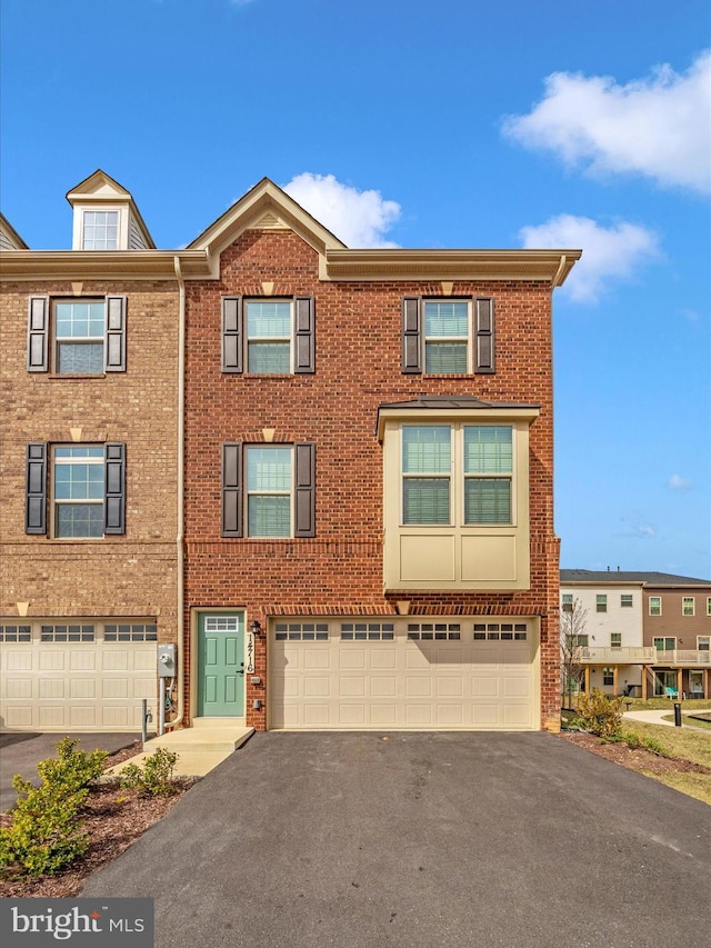 14716 Spring Haven Ln, Laurel, MD 20707 - view of property featuring asphalt driveway, brick siding, and an attached garage