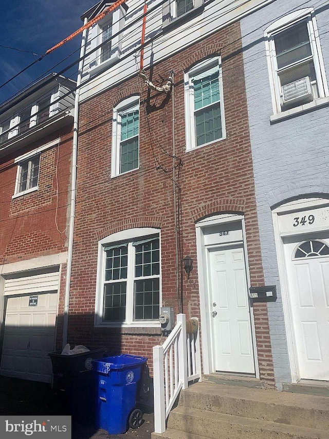 view of front of house with brick siding