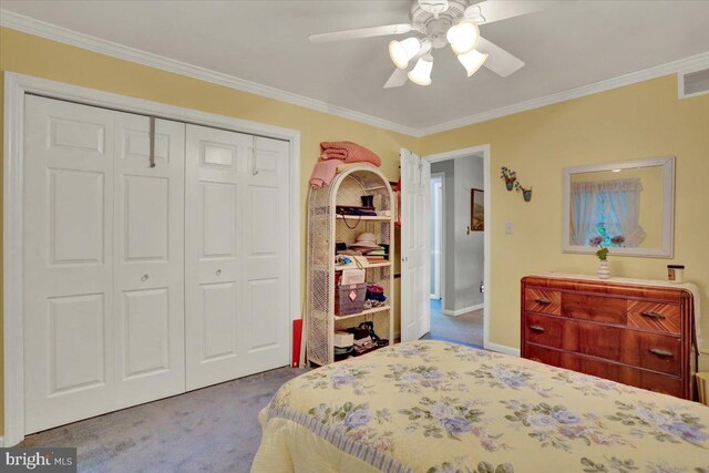 bedroom with dark carpet, ornamental molding, a closet, ceiling fan, and baseboards