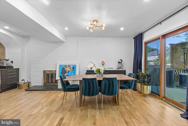 1745 Remington Dr, Crofton, MD 21114 - dining area featuring light wood-style floors, a brick fireplace, a chandelier, and recessed lighting