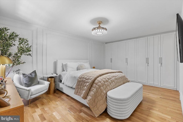 1745 Remington Dr, Crofton, MD 21114 - bedroom featuring light wood-style floors and a decorative wall