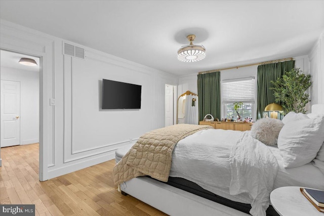 1745 Remington Dr, Crofton, MD 21114 - bedroom with light wood-style floors and a decorative wall