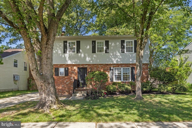 1745 Remington Dr, Crofton, MD 21114 - colonial inspired home featuring brick siding and a front lawn