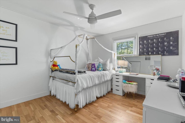 1745 Remington Dr, Crofton, MD 21114 - bedroom with light wood-style flooring, an office area, a ceiling fan, and baseboards