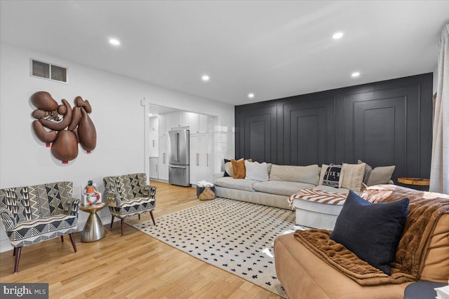1745 Remington Dr, Crofton, MD 21114 - living room featuring light wood-style floors and recessed lighting