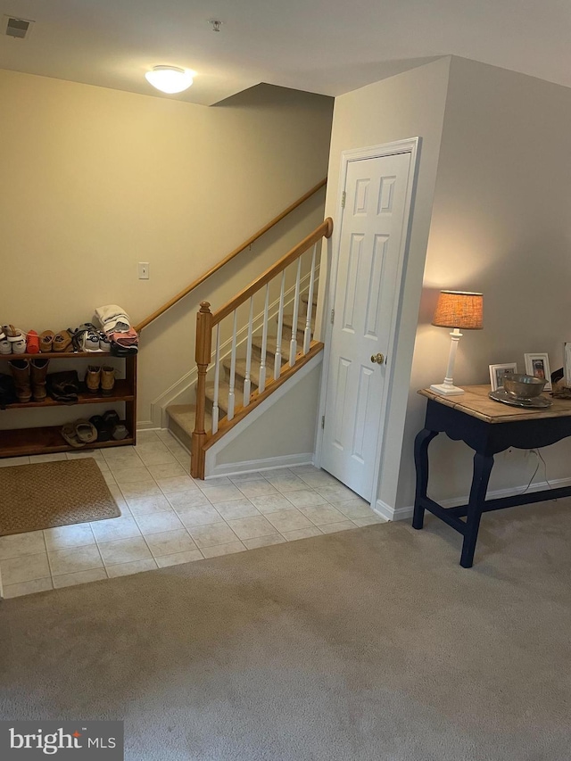 310 Hilltop Ln, Chestertown, MD 21620 - staircase with carpet, tile patterned flooring, and baseboards
