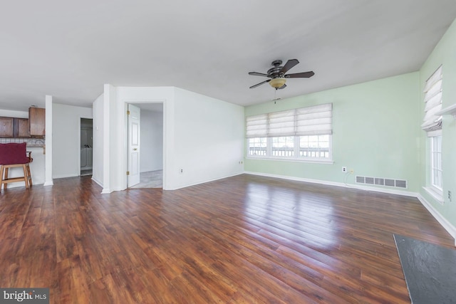 217 Pratt Ct, Sewell, NJ 08080 - unfurnished living room with plenty of natural light, a ceiling fan, and dark wood-style floors