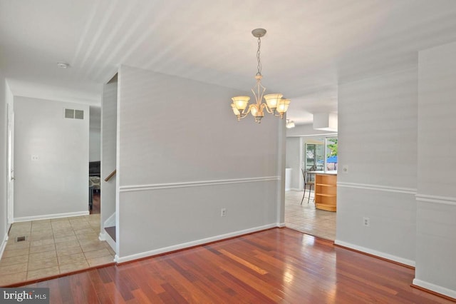 780 Cotswolde Quay Ct, Severna Park, MD 21146 - unfurnished dining area featuring a chandelier, wood finished floors, and baseboards