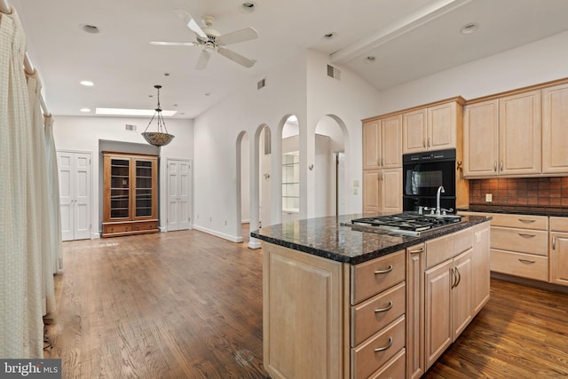 6802 Nesbitt Pl, Mclean, VA 22101 - kitchen with light brown cabinetry, stainless steel gas cooktop, a ceiling fan, decorative backsplash, and recessed lighting