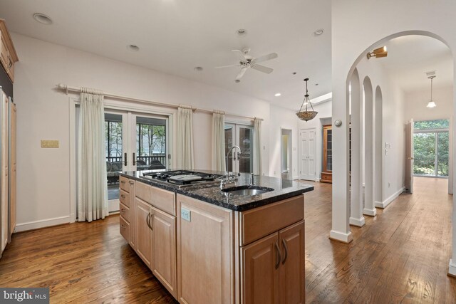 6802 Nesbitt Pl, Mclean, VA 22101 - kitchen with a sink, a ceiling fan, dark wood-type flooring, dark stone countertops, and recessed lighting