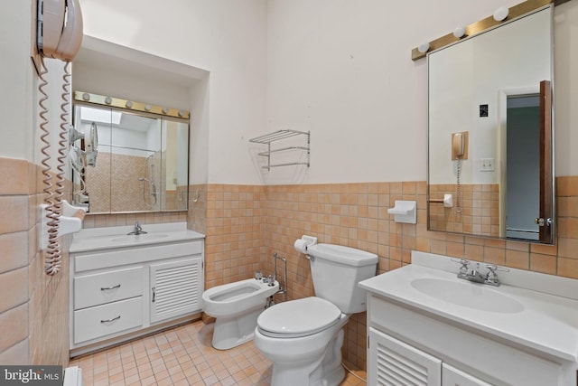 6802 Nesbitt Pl, Mclean, VA 22101 - bathroom featuring a bidet, vanity, wainscoting, tile walls, and toilet