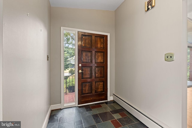 6802 Nesbitt Pl, Mclean, VA 22101 - foyer featuring a baseboard radiator, dark stone finish floors, and baseboards