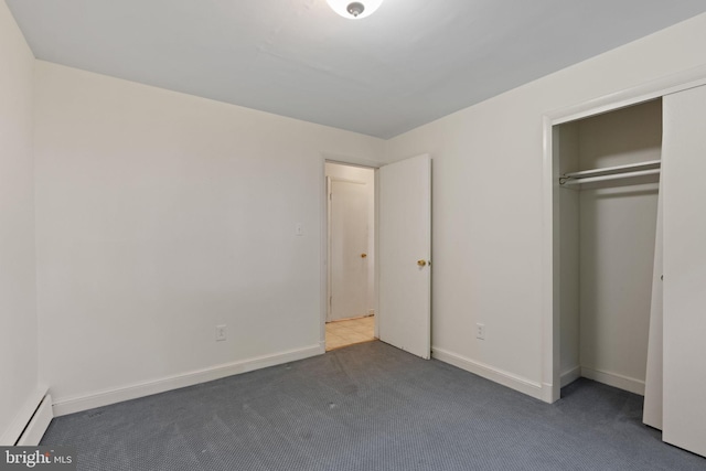 6802 Nesbitt Pl, Mclean, VA 22101 - unfurnished bedroom featuring baseboard heating, carpet floors, a closet, and baseboards