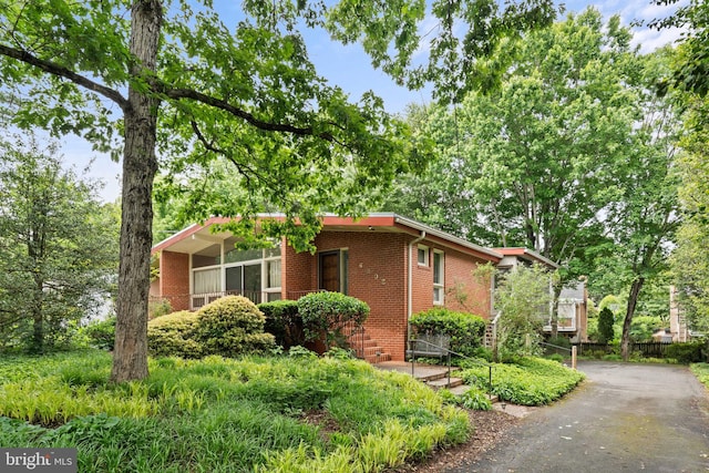 6802 Nesbitt Pl, Mclean, VA 22101 - view of side of property featuring brick siding and driveway