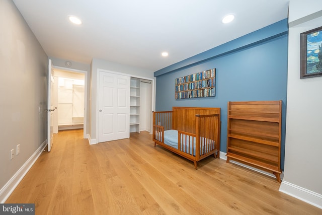 1919 Chestnut St Unit 523-524, Philadelphia, PA 19103 - bedroom with light wood-type flooring, a closet, baseboards, and recessed lighting