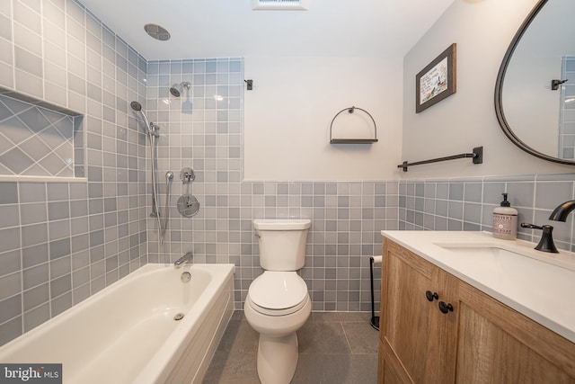 1919 Chestnut St Unit 523-524, Philadelphia, PA 19103 - full bathroom featuring tile walls, toilet, shower / bath combination, tile patterned floors, and vanity