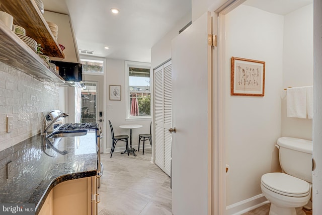 1823 4th St NW, Washington, DC 20001 - bathroom with a sink, toilet, baseboards, recessed lighting, and a closet