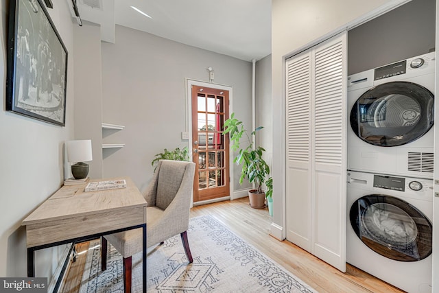 1823 4th St NW, Washington, DC 20001 - laundry room with stacked washer / drying machine, light wood finished floors, an office area, and baseboards