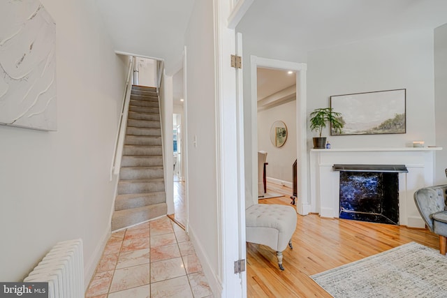 1823 4th St NW, Washington, DC 20001 - foyer featuring radiator heating unit, baseboards, stairs, and a fireplace