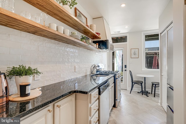1823 4th St NW, Washington, DC 20001 - kitchen featuring open shelves, stainless steel appliances, backsplash, baseboards, and dark stone counters