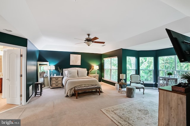 bedroom featuring carpet flooring, multiple windows, and a ceiling fan