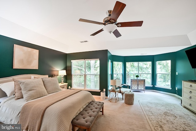 bedroom with carpet floors, multiple windows, baseboards, and lofted ceiling