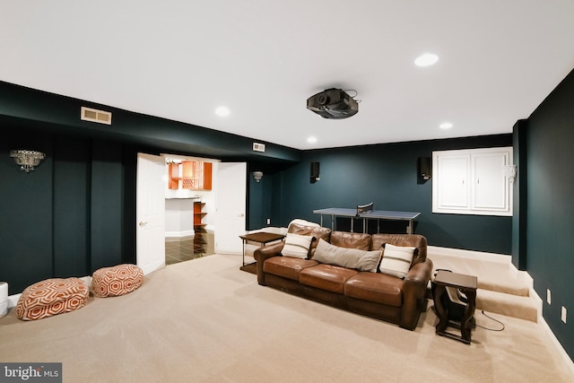 carpeted cinema with recessed lighting and baseboards