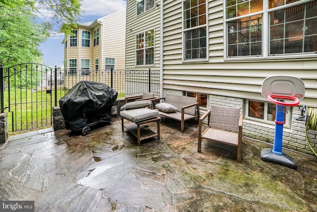 view of patio / terrace with area for grilling and fence