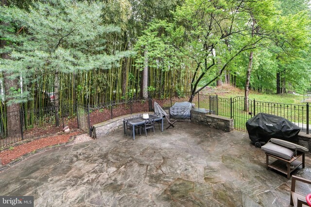 view of patio with fence and grilling area