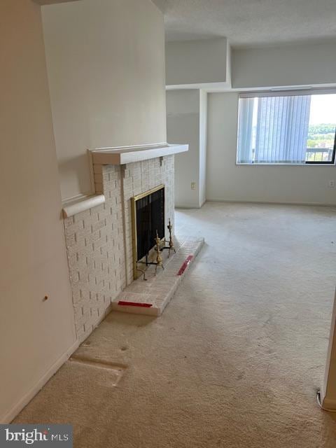200 N Pickett St Unit 1614, Alexandria, VA 22304 - unfurnished living room with light carpet and a fireplace