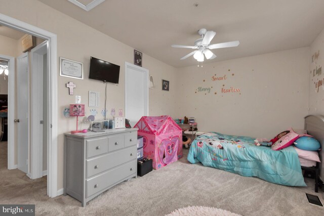 bedroom featuring light colored carpet