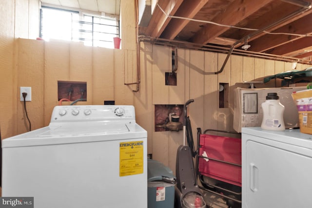 laundry area with washing machine and clothes dryer