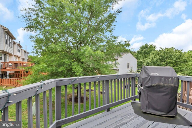 wooden deck with grilling area
