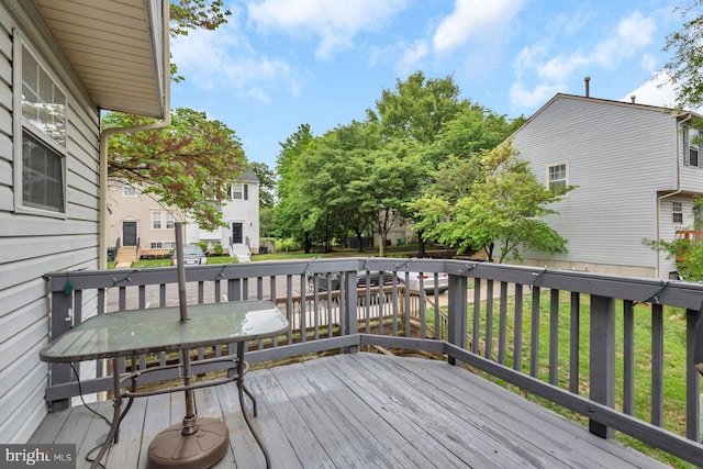 wooden terrace with a residential view