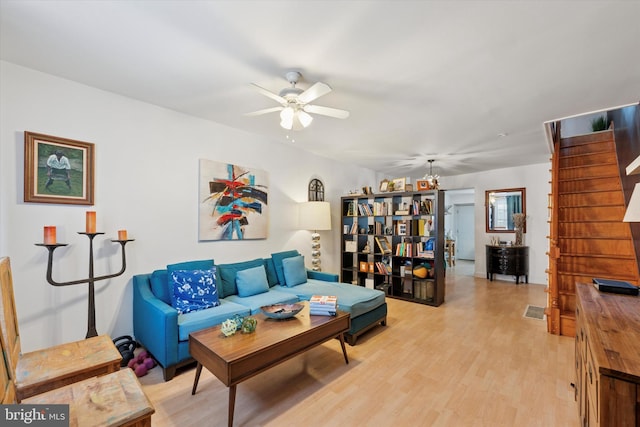 2429 S Reese St, Philadelphia, PA 19148 - living area featuring stairs, a ceiling fan, and light wood-type flooring