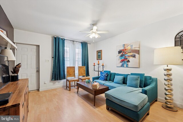 2429 S Reese St, Philadelphia, PA 19148 - living room with light wood-style flooring, ceiling fan, and baseboards