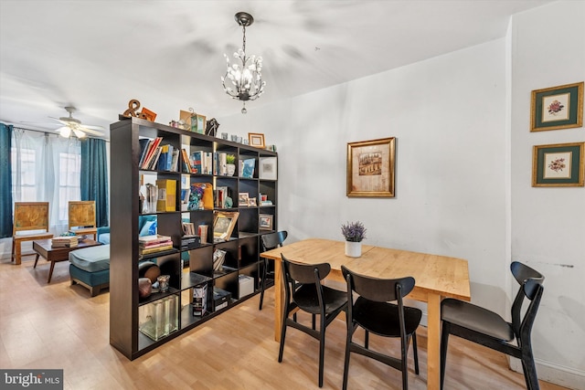 2429 S Reese St, Philadelphia, PA 19148 - dining space with a chandelier, light wood finished floors, and ceiling fan