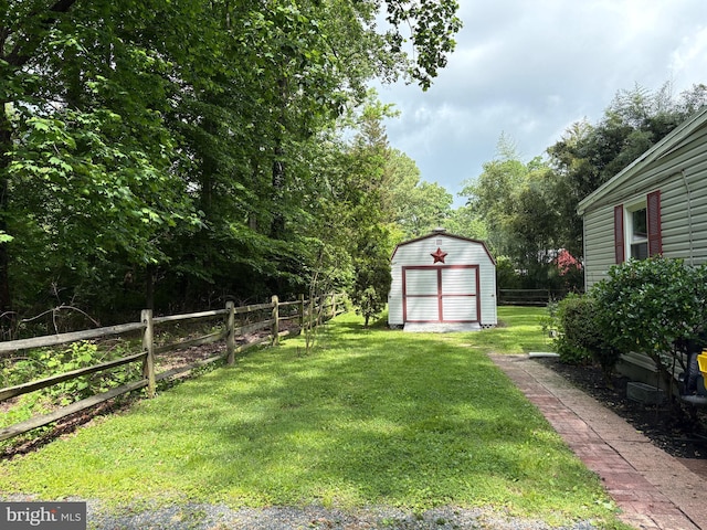 view of yard featuring a storage shed and an outdoor structure