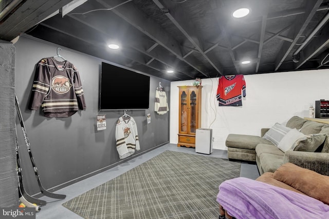 home theater featuring finished concrete flooring and recessed lighting
