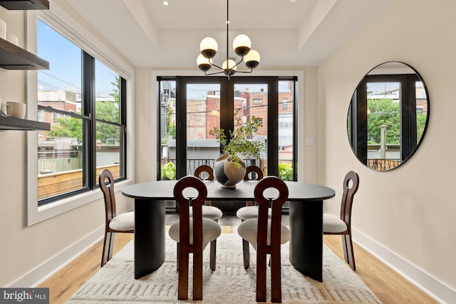919 French St NW, Washington, DC 20001 - dining space featuring a raised ceiling, a chandelier, and plenty of natural light