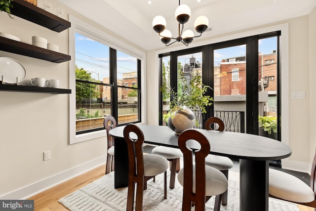 919 French St NW, Washington, DC 20001 - dining area with a chandelier, baseboards, and wood finished floors