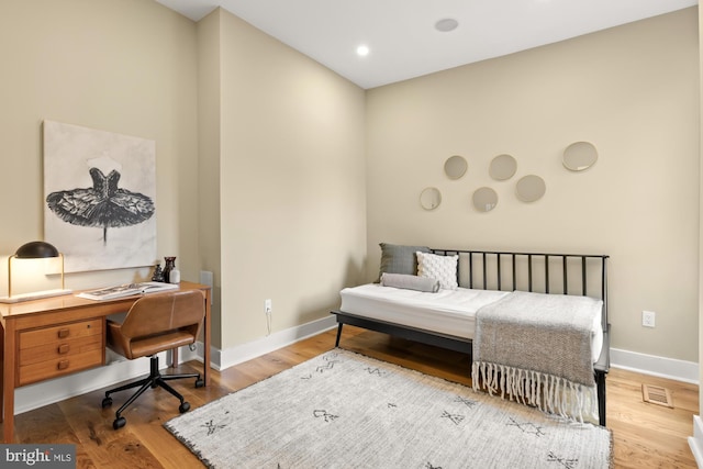 919 French St NW, Washington, DC 20001 - bedroom featuring a desk, wood finished floors, and baseboards